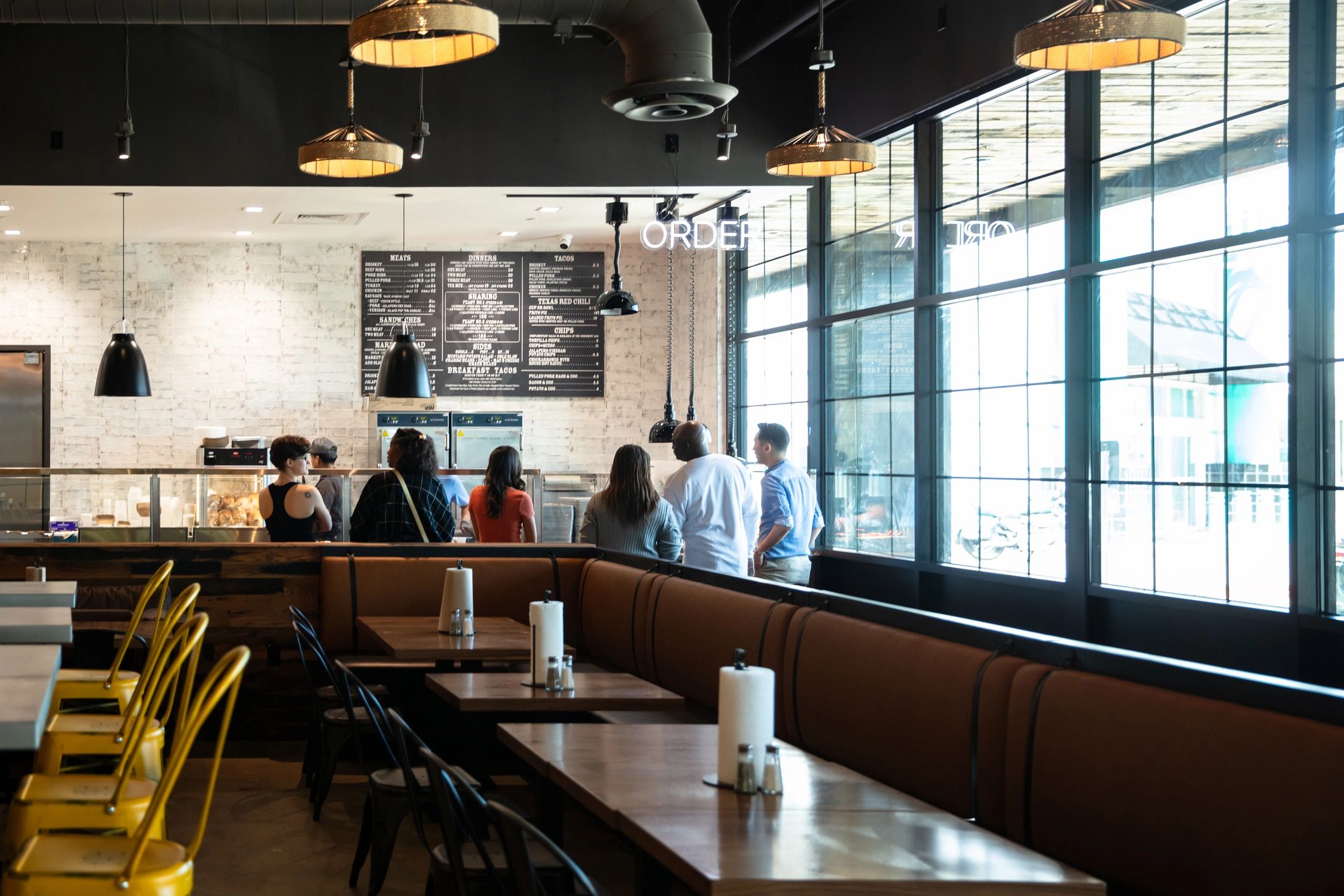 Warm restaurant interior with guests and inviting atmosphere
