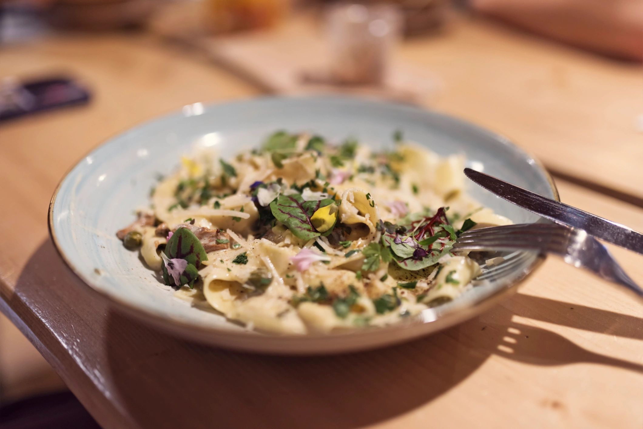 Creamy pasta topped with herbs and cheese